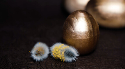 Painted Easter eggs and pussy willow branches on light background. High quality photo
