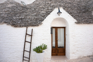 Alberobello town in Italy, famous for its hictoric trullo houses - obrazy, fototapety, plakaty