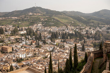 Obraz premium Aerial panoramic view on buildings, old district, mountains and palace, world heritage city Granada, Andalusia, Spain