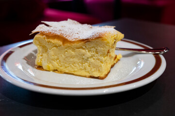 Austrian sweet dessert, filled with white cheese strudel served warm in traditional cafe in Vienna, Austria