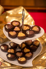 Food styling in bakery, wedding or happy valentine chocolate candies decorated with hearts and flowers