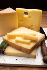 Swiss cheese collection, holes emmentaler and gruyere cheese made from unpasteurized cow's milk