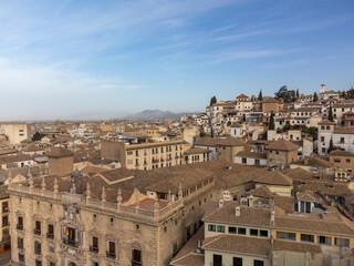 Aerial panoramic view on buildings, old district, mountains and palace, world heritage city Granada, Andalusia, Spain