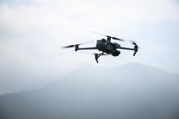 Fototapeta na wymiar Drone flying in spring forest