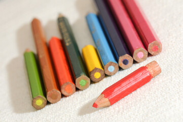 Colorful and funny arrangement of a set of pencils and ink pots.