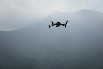 Fototapeta na wymiar Drone flying in spring forest