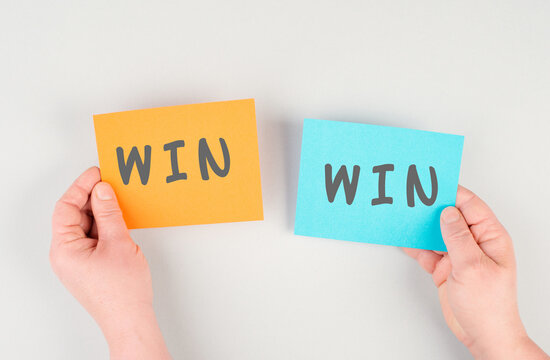 The word win is standing on paper, problem solving, winner mindset, business and education concept, coaching and motivation