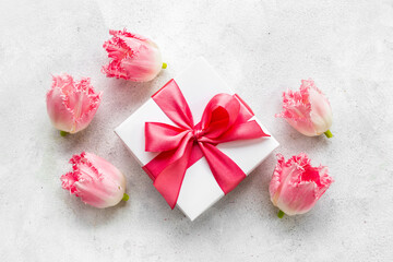 Fototapeta na wymiar Happy Mothers day. Pink flowers with white gift box