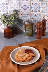 Breaded chicken cotoletta with tomato sauce