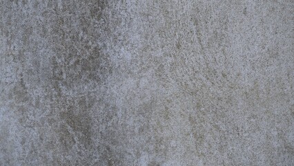 The old cement wall was weathered, the surface was scratched, the surface was scratched and damaged. For a mysterious retro-conservative background.