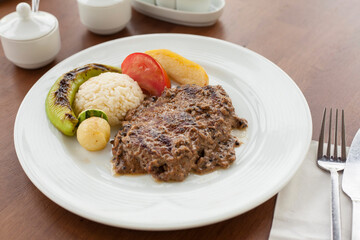 Roasted Meat and Rice Served on Plate