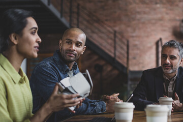 African American businessman listening to a business presentation