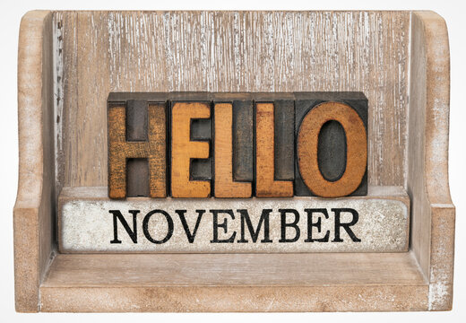 Hello November in vintage letterpress wood type inside grunge wooden box, calendar concept