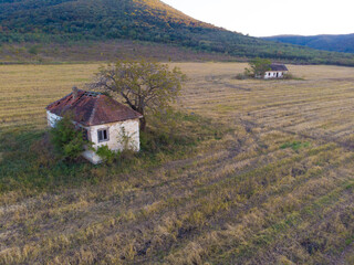 Abandoned houses in the field. Aerial photo.