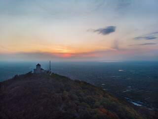 Fototapeta na wymiar Fortress over the town of Vršac and the sunset. Aerial photography.