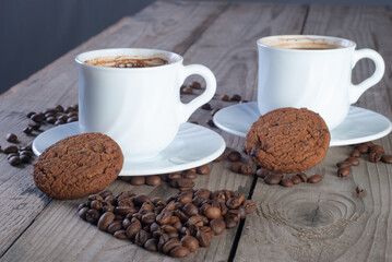 Fresh coffee with biscuits and roasted beans