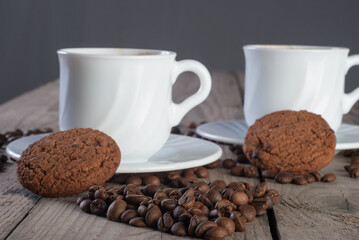 Fresh coffee with biscuits and roasted beans