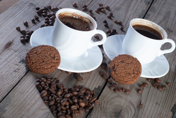 Fresh coffee with biscuits and roasted beans