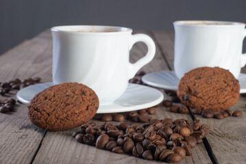 Fresh coffee with biscuits and roasted beans