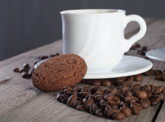 Fresh coffee with biscuits and roasted beans