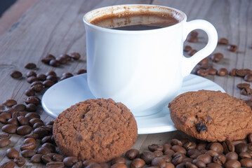 Fresh coffee with biscuits and roasted beans