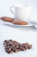 Fresh coffee with biscuits and roasted beans