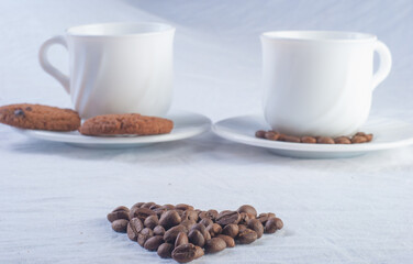 Fresh coffee with biscuits and roasted beans