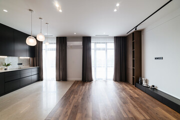 Fototapeta na wymiar stylish interior of the Studio kitchen with large windows in the new house