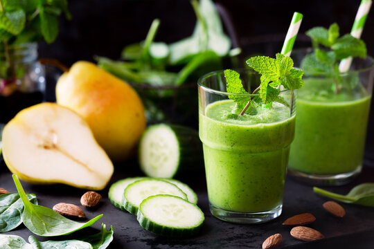 Healthy green detox smoothie with cucumbers, pear, spinach and mint