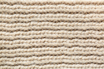 textured brown macro sweater,Seamless texture of handmade knitting of natural yarn. Sheep common wool. Knitted background. Closeup