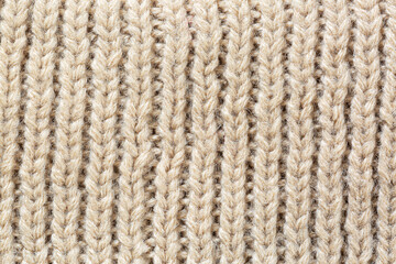 textured brown macro sweater,Seamless texture of handmade knitting of natural yarn. Sheep common wool. Knitted background. Closeup