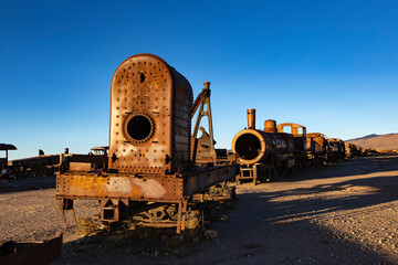 Train Cemetery in Uyuni, Old rusty trains, railway museum at sunset lights, Uyuni, Bolivia