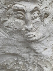 Fototapeta na wymiar texture face carved in chalk