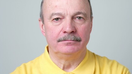 Fototapeta premium Mature adult man laughing looking at the camera. Positive emotion concept