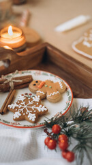Fototapeta premium Christmas cookies on a plate with Christmas decorations
