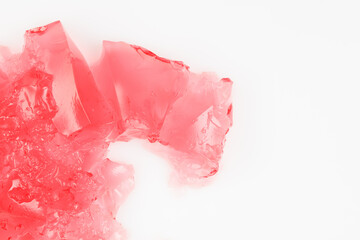 Pink jelly or marmalade on a white background.