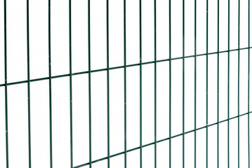 Metal fence on a white insulated background.