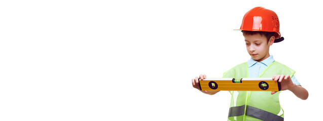 building, construction and profession concept - little caucasian boy in protective helmet and safety vest with level over white background