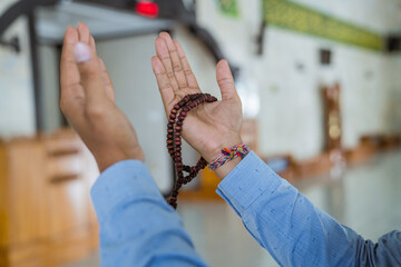 portrait of asian Man muslim doing prayer in the mosque