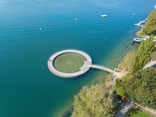 Aerial image of the public swimming pool at the Zurich lake side with a wooden circle toddler pond