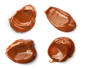 Set of melted caramel smears isolated on white background.