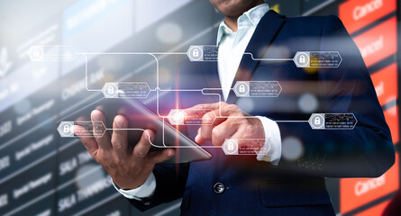 A chain diagram and encrypted blocks are used to demonstrate the blockchain technology idea. A businessman's hand holding a digital tablet, as well as a business plan and social media diagram.