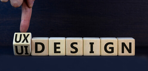 UX user experience design or UI user interface design symbol. Turned wooden cubes and changed words...