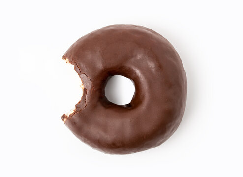 One bite missing of chocolate donut on white background.
