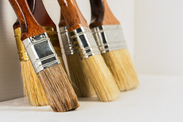 Set of new paint brushes ready to use close-up with copy space