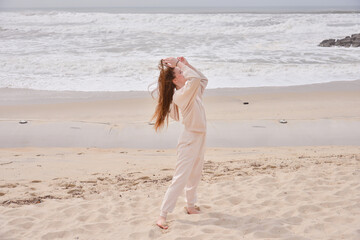young girl happy on the beach ocean