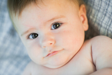 Cute baby close up portrait in sunset light