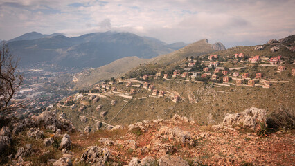 Obraz premium Sicilian Italian Coastal Hill Landscape near Palermo in Europe, on a foggy cloudy spring day