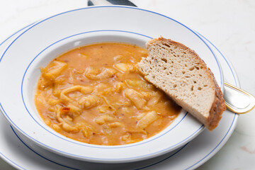 onion soup served with slice of bread