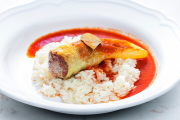 pepper stuffed with minced meat served with tomato sauce and rice